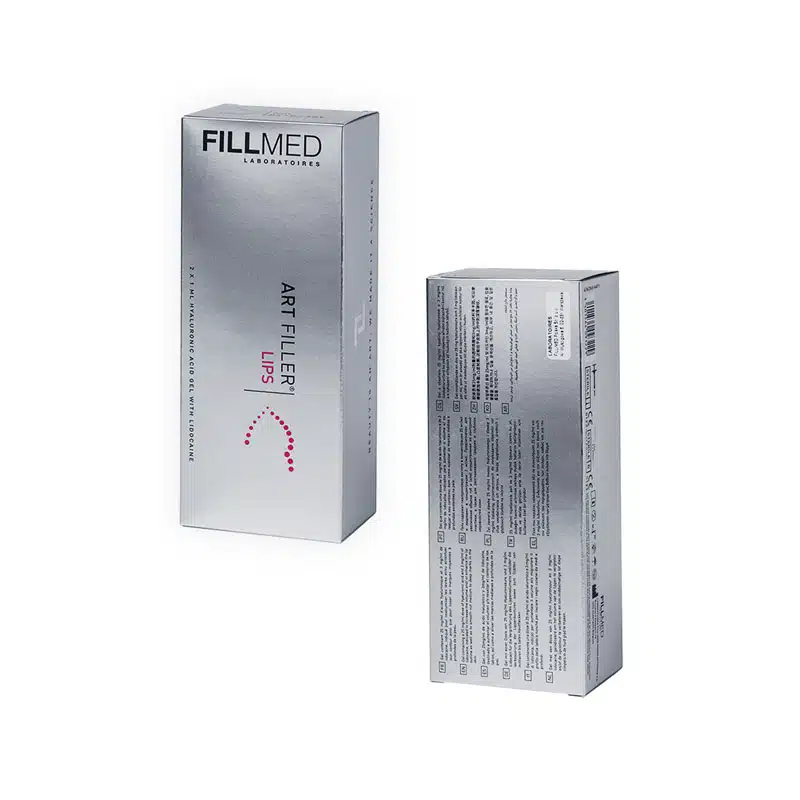 An image of two silver-colored boxes of FILLMED® ART FILLER LIPS with Lidocaine product. One box is shown from the front and the other from the back, displaying product branding and ingredients. The boxes have clean, minimalist designs with text in black and white.