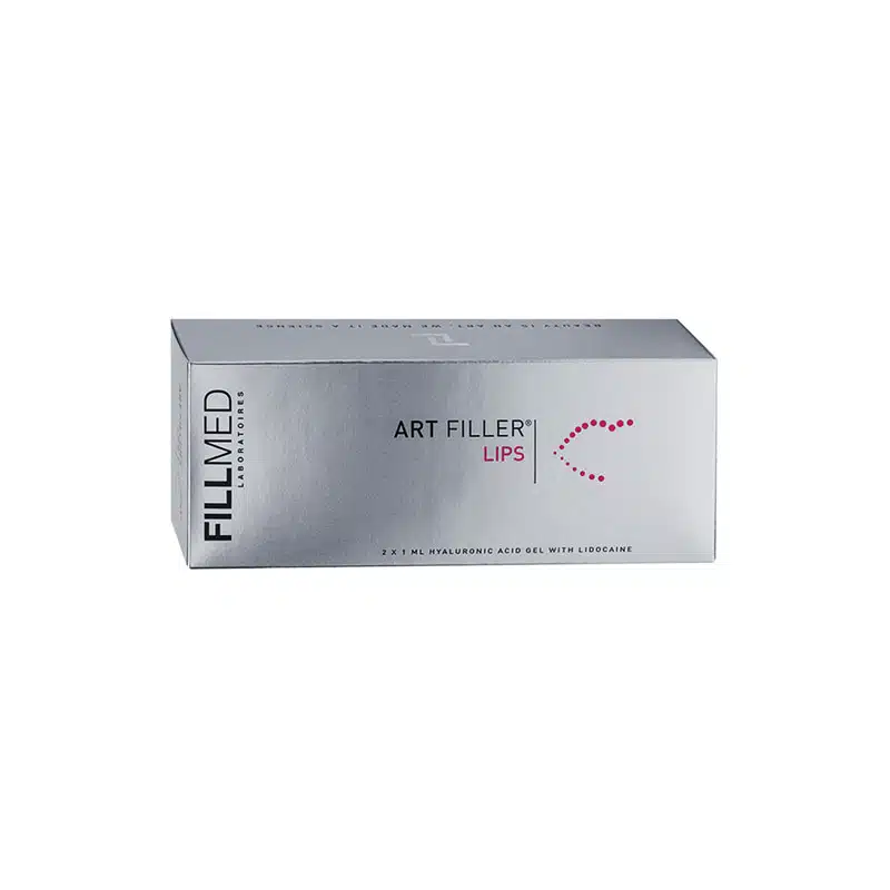 A rectangular silver box of FILLMED® ART FILLER LIPS with Lidocaine. The box features minimal text with the product name centered and a pink dotted arrow design. The manufacturer's name, Fillmed Laboratoires, is vertically oriented on the left side of the box.