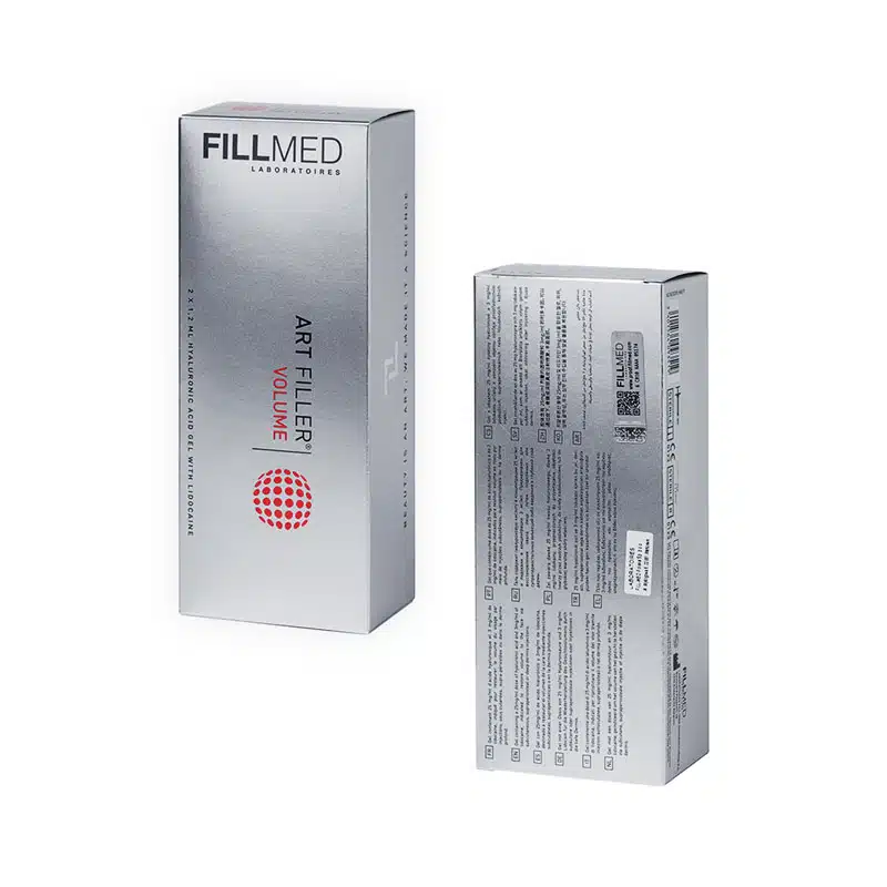 Image shows two boxes of FILLMED® ART FILLER VOLUME, one facing forward and the other showing the back. The front box has minimalist silver packaging with red and black text. The back box displays product information and a QR code.