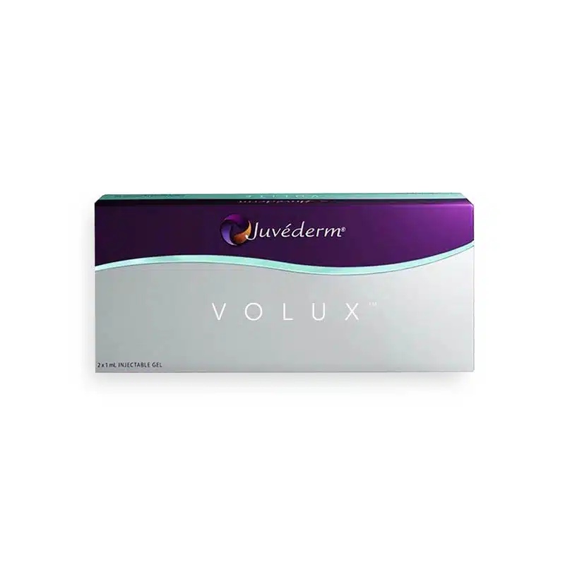 Image of a white and purple box with the brand name "JUVÉDERM®" and the product name "VOLUX® with Lidocaine" written on it. The box contains 2 x 1 ml injectable gel syringes. The design includes a purple and teal wavy line across the top.