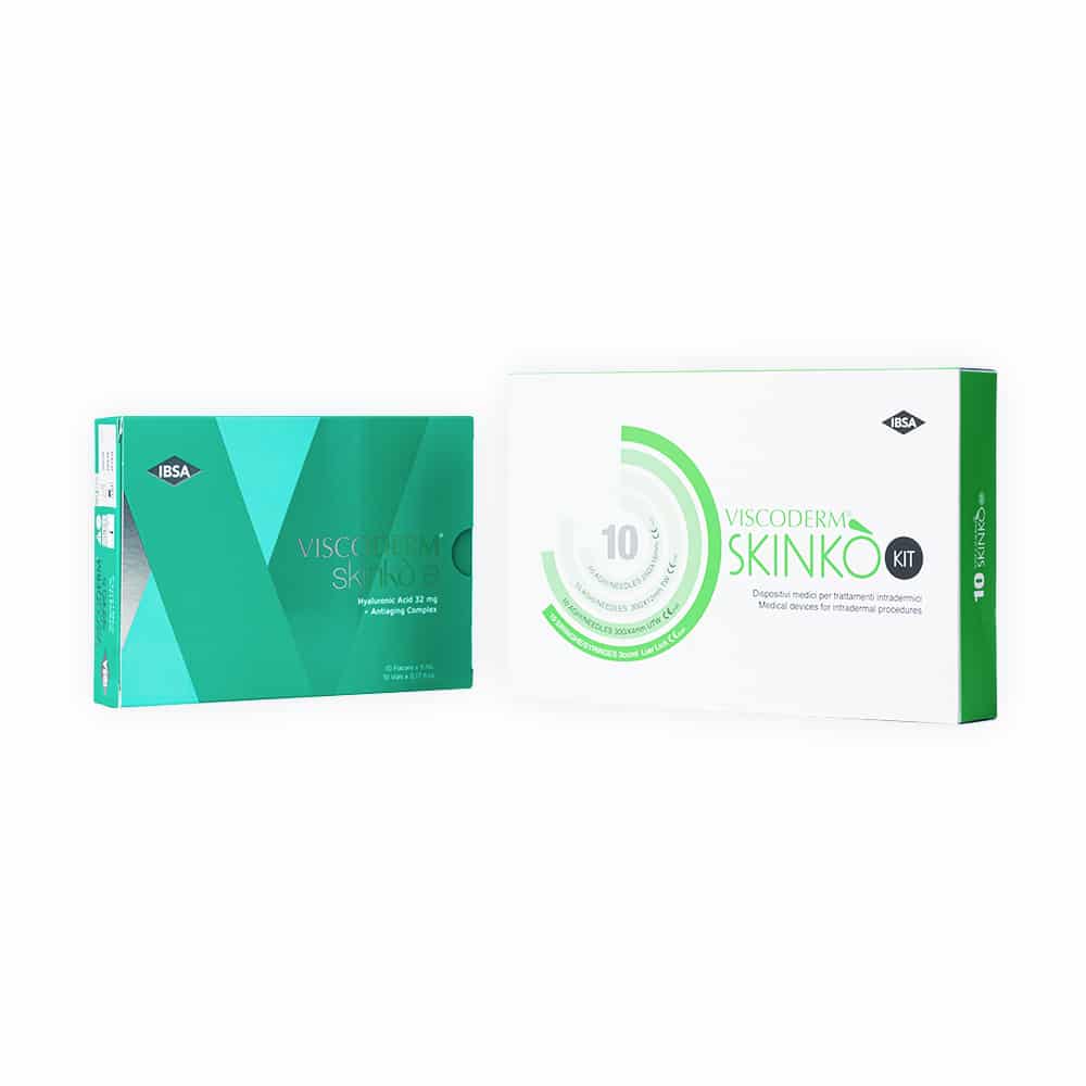 Two rectangular product packaging boxes are displayed against a white background. The left box is teal-colored and has "VISCODERM® SKINKÒ E" written on it. The right box is white and green with "VISCODERM® SKINKÒ KIT" text.