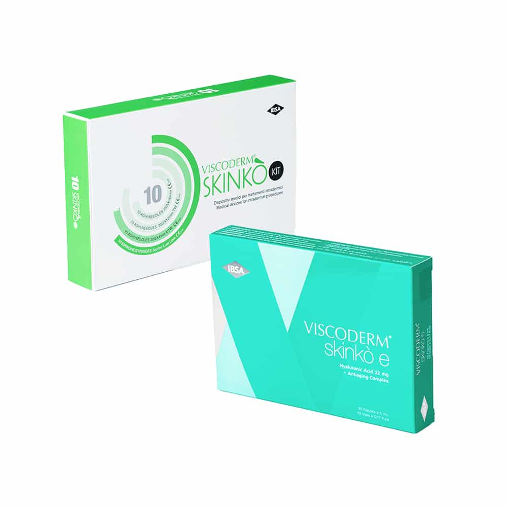 Two product boxes on a white background. The left box, labeled "VISCODERM® SKINKÒ KIT," is white and green with circular graphics. The right box, labeled "VISCODERM® SKINKÒ E + VISCODERM® SKINKÒ KIT," is turquoise with white and light blue geometric shapes.