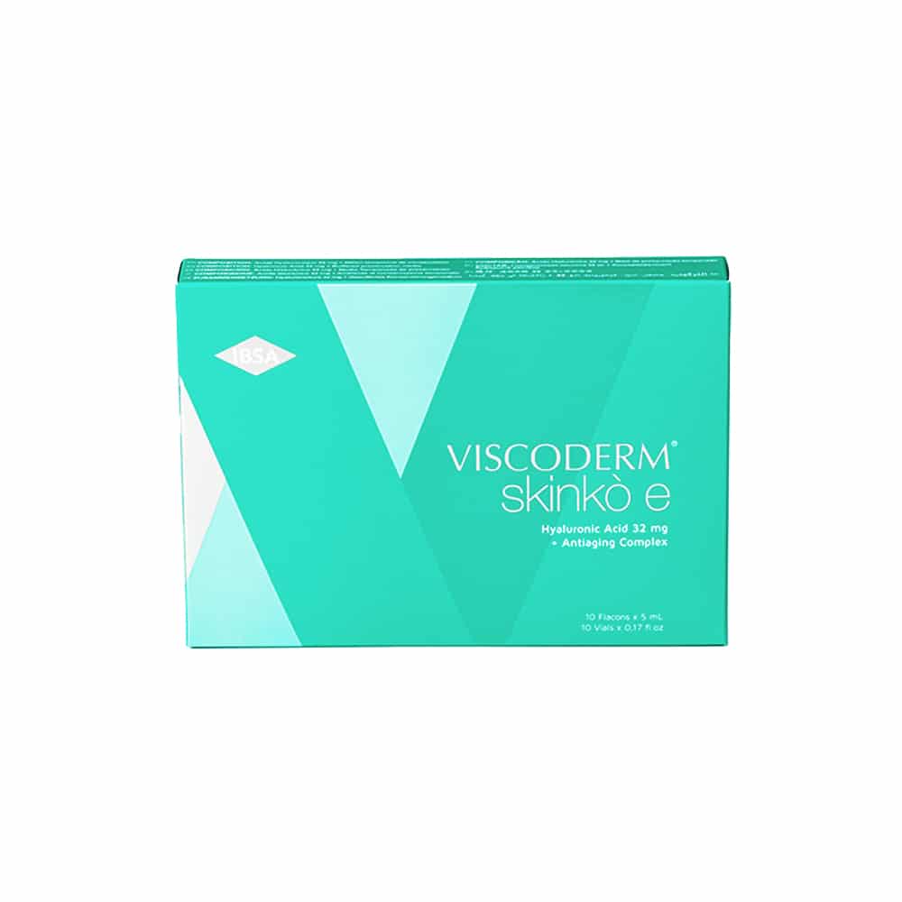 Image of a box of VISCODERM® SKINKÒ E + VISCODERM® SKINKÒ KIT, a skincare product. The box is turquoise with white accents and text stating "VISCODERM skinko e" and "Hyaluronic Acid 32 mg - Anti-aging Complex." The box contains 10 vials x 5 ml.