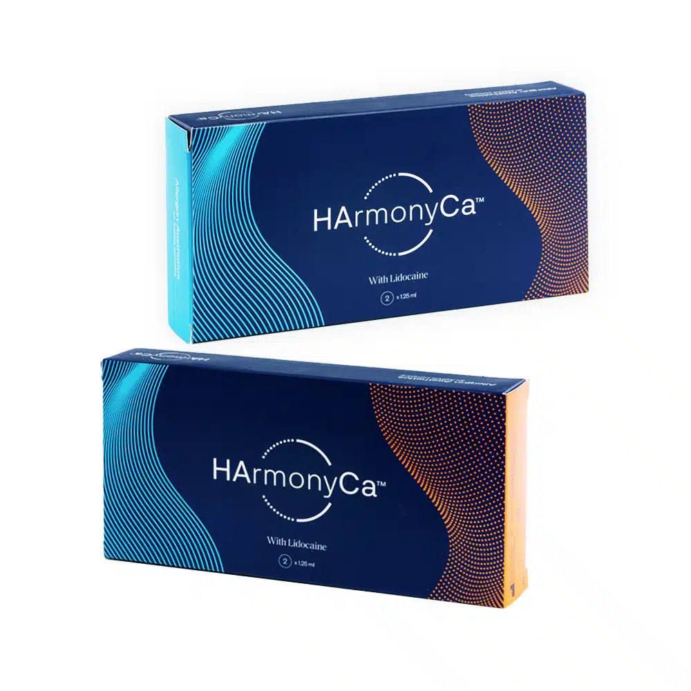 Two boxes of HArmonyCA™ with Lidocaine are displayed. The upper box has a blue gradient design with wave patterns, and the lower box has a similar design with orange accents. Each box indicates a 1.25ml volume. The packaging is sleek and modern.