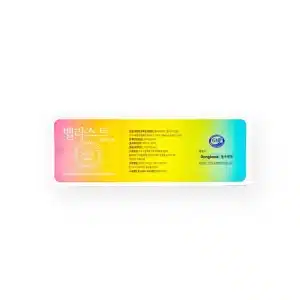 A rectangular medical patch package with a gradient background from yellow to blue. The text is mainly in Korean, featuring product information and branding. The label includes seals of certification and the manufacturer's name "Dongkook" and the product name BELLAST® SOFT L.