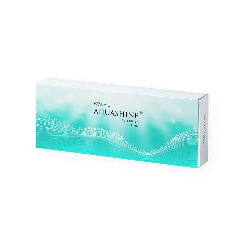 The image shows a rectangular box of REVOFIL AQUASHINE BR SOFT FILLER - 2 Pre-Filled Syringes, containing 2mL of product. The box features a white and light blue design with wave patterns and small dots, giving an impression of freshness and hydration.