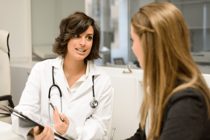 Person talking to doctor.