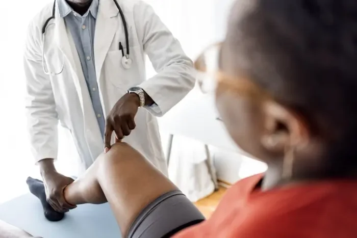 Person checking knee.
